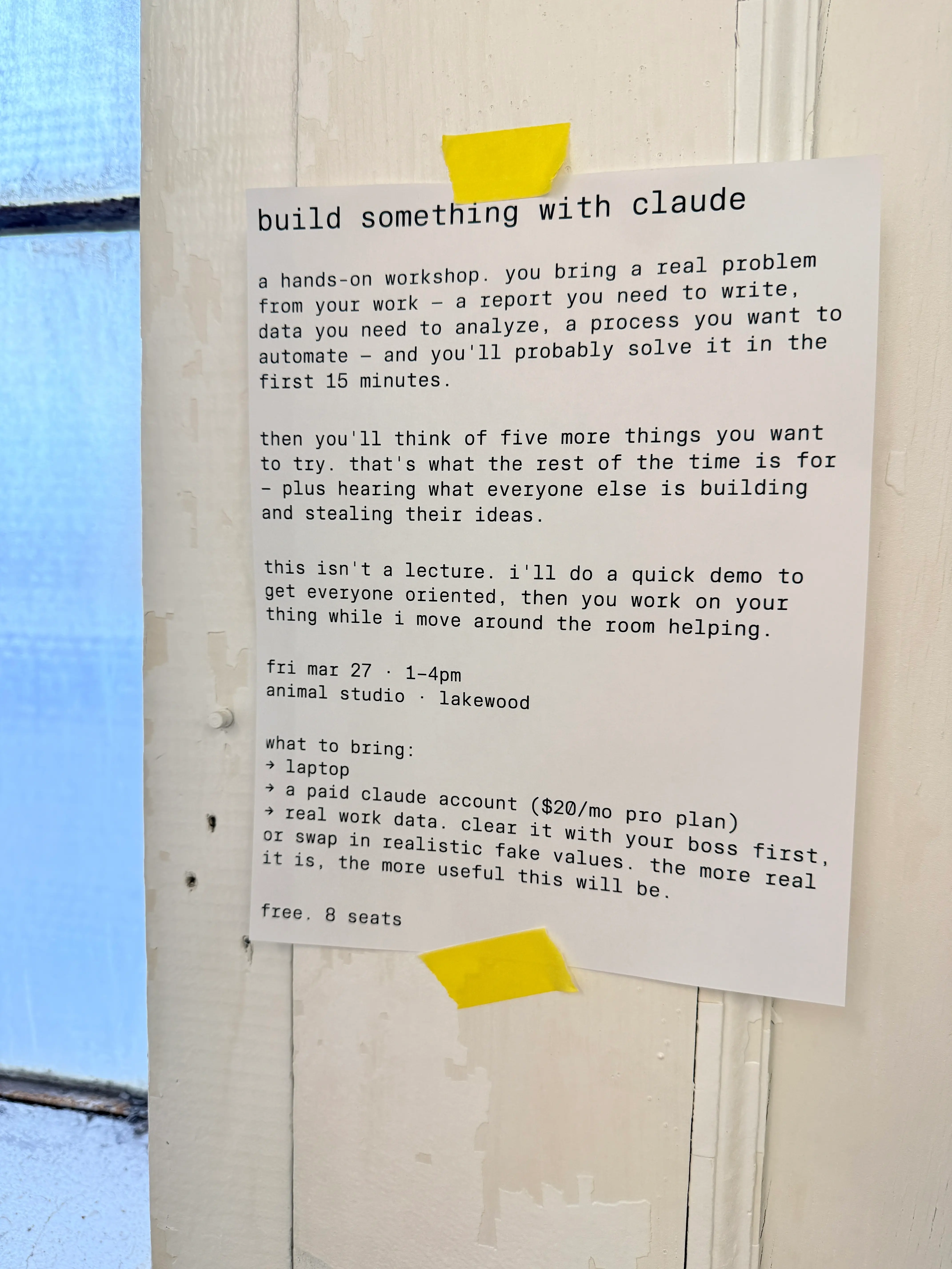 build something with claude — a hands-on workshop flyer taped to a door at animal studio